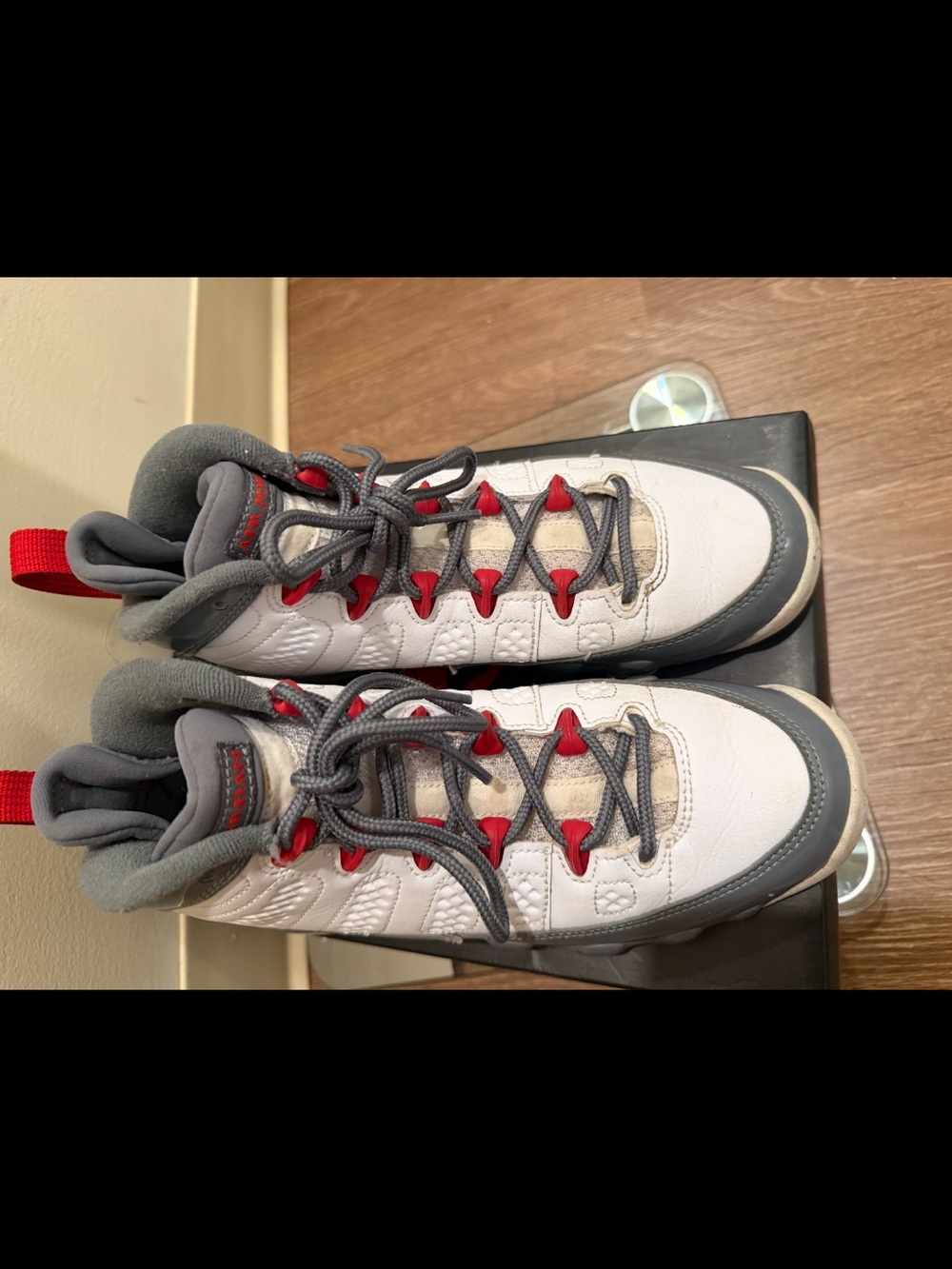 White and Gray Athletic Sneakers with Red Accents